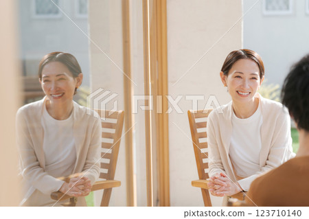 Couple talking on balcony Couple talking on balcony 123710140