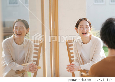 Couple talking on balcony 123710142