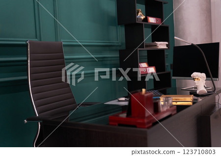 High-tech and luxurious office of the director of the company. which has a modern wooden table and an armchair. High quality photo 123710803