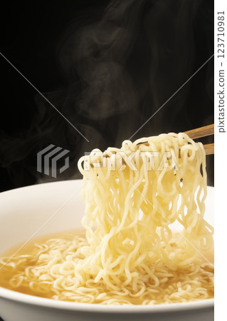 Picking up the noodles of plain ramen with chopsticks. Ramen without toppings. Picking up the noodles of plain ramen with chopsticks. Ramen without toppings. 123710981
