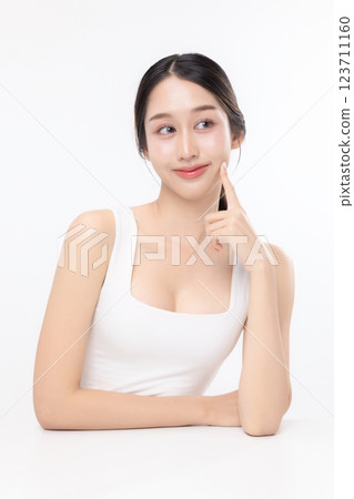 Close up facial of young Asian beautiful woman with K-beauty make up style and healthy and perfect glow skin with copyspace isolated on white background for skincare commercial product advertising. 123711160