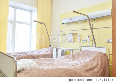 In the intensive care unit of a modern medical center. A hospital ward with two specially designed beds for patients awaiting hospitalization,. High quality photo In the intensive care unit of a modern medical center. A hospital ward with two specially designed beds for patients awaiting hospitalization,. High quality photo 123711183