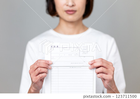 Middle-aged woman with resume 123711500