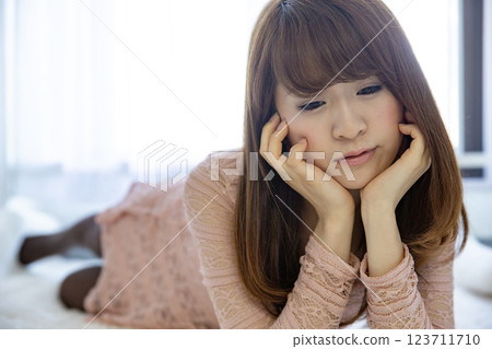 A young lady with a cheeks stick 123711710