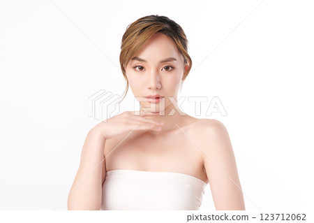 A beautiful young Asian woman with clean, fresh skin against a white background. She represents beauty, skincare, and spa treatments. A beautiful young Asian woman with clean, fresh skin against a white background. She represents beauty, skincare, and spa treatments. 123712062