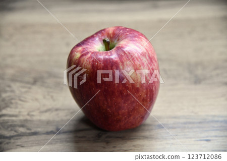Plate with apples and autumn leaves on wooden table Plate with apples and autumn leaves on wooden table 123712086