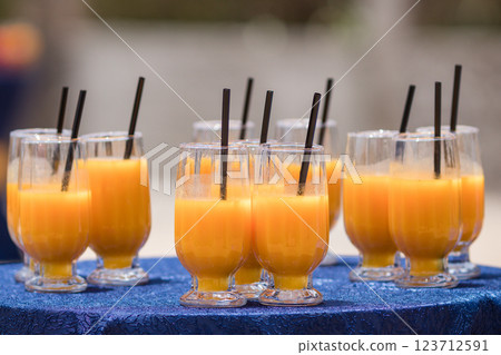 fresh orange juice in glass on wooden table 123712591