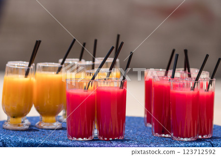 fresh orange juice in glass on wooden table 123712592