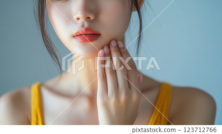 Close up of a woman touching her face, skincare concept. Beauty and wellness. 123712766