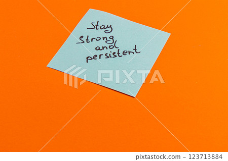 Motivational note emphasizing strength and persistence on vibrant background 123713884