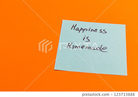 A handwritten note reads Happiness is homemade on a bright orange background 123713888