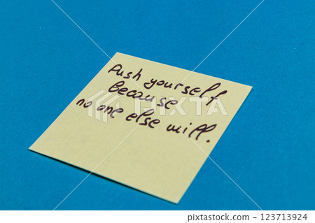 Motivational note on sticky paper encourages personal growth and self-push Motivational note on sticky paper encourages personal growth and self-push 123713924