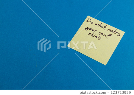 Motivational sticky note on a blue background encouraging personal passion 123713939