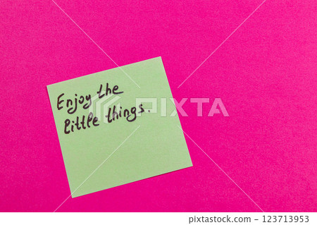 Inspirational note on pink background: cherish small joys Inspirational note on pink background: cherish small joys 123713953
