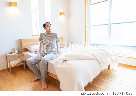 Men sitting on bed Men sitting on bed 123714053