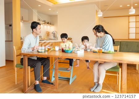 Young family eating at the table 123714157