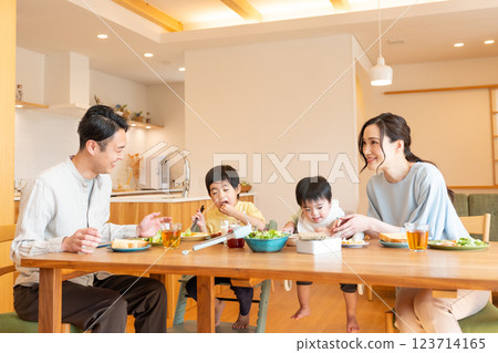 Young family eating at the table 123714165