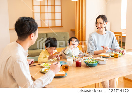 Young family eating at the table Young family eating at the table 123714170