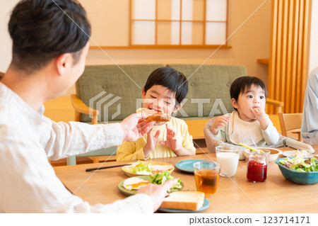 Young family eating at the table 123714171