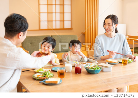 Young family eating at the table Young family eating at the table 123714172