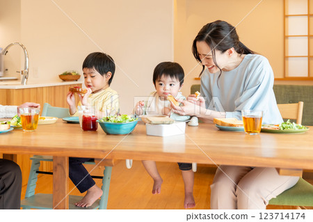 Young family dining at the dining room Young family dining at the dining room 123714174