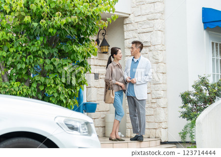 Middle-aged couple, house, car 123714444