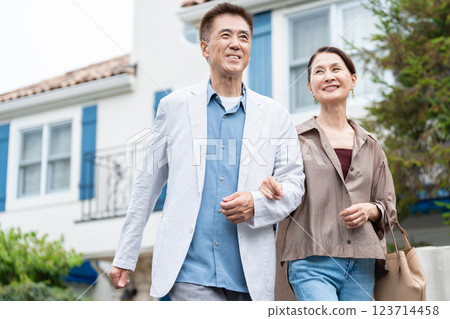 Senior couple cuddling with a smile Senior couple cuddling with a smile 123714458