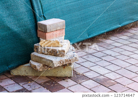 Bricks are neatly stacked on a sidewalk that is made entirely of bricks Bricks are neatly stacked on a sidewalk that is made entirely of bricks 123714647