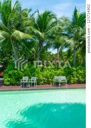 empty chair around swimming pool empty chair around swimming pool 123714902