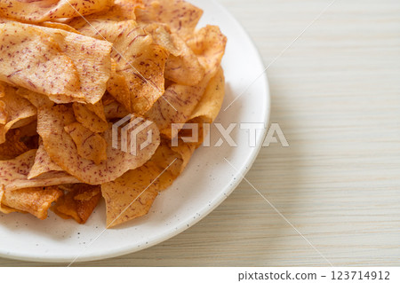 Taro Chips - fried or baked sliced taro Taro Chips - fried or baked sliced taro 123714912