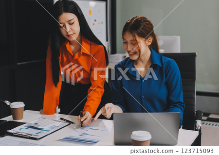 Entrepreneur Asian businessman and businesswoman discussing new business project in tablet in modern Meeting In Modern Office, Asian business casual concept. Entrepreneur Asian businessman and businesswoman discussing new business project in tablet in modern Meeting In Modern Office, Asian business casual concept. 123715093