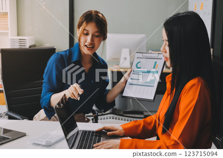 Entrepreneur Asian businessman and businesswoman discussing new business project in tablet in modern Meeting In Modern Office, Asian business casual concept. Entrepreneur Asian businessman and businesswoman discussing new business project in tablet in modern Meeting In Modern Office, Asian business casual concept. 123715094