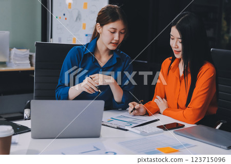 Entrepreneur Asian businessman and businesswoman discussing new business project in tablet in modern Meeting In Modern Office, Asian business casual concept. Entrepreneur Asian businessman and businesswoman discussing new business project in tablet in modern Meeting In Modern Office, Asian business casual concept. 123715096