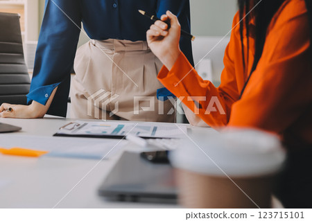 Entrepreneur Asian businessman and businesswoman discussing new business project in tablet in modern Meeting In Modern Office, Asian business casual concept. Entrepreneur Asian businessman and businesswoman discussing new business project in tablet in modern Meeting In Modern Office, Asian business casual concept. 123715101