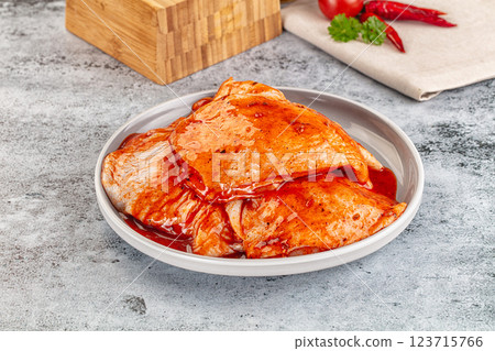 Raw chicken marinated thighs with skin Raw chicken marinated thighs with skin 123715766