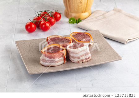 Raw pork tenferloin with bacon 123715825