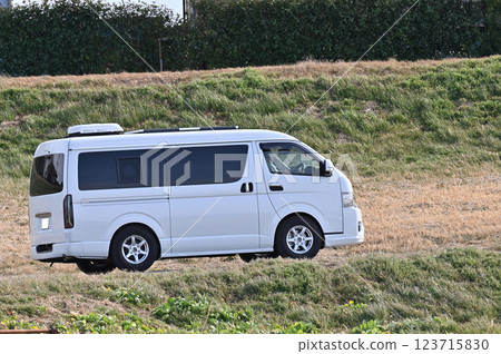 A camper van with an air conditioner on the roof 123715830