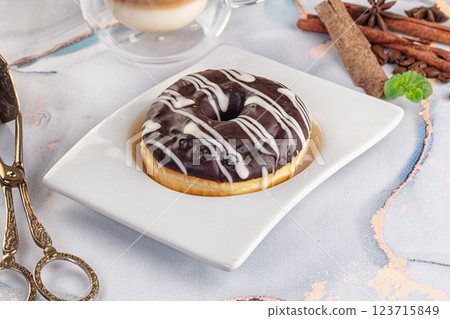 Delicous sweet donut with chocolate glaze Delicous sweet donut with chocolate glaze 123715849