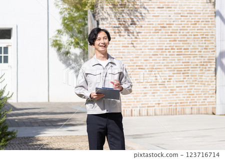 A businessman working at a construction site A businessman working at a construction site 123716714
