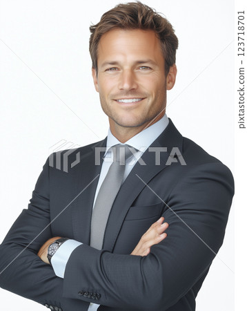 Handsome middle-aged male businessman standing with his arms crossed and a confident smile Handsome middle-aged male businessman standing with his arms crossed and a confident smile 123718701