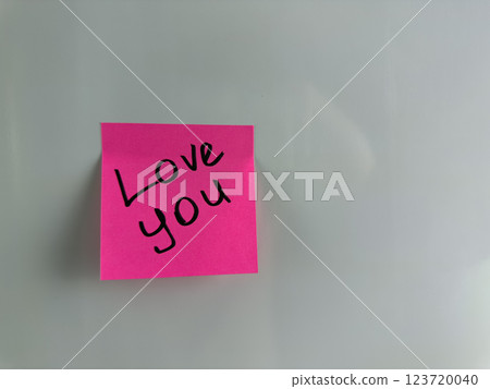 Sweet message with words of love written on sticky note Sweet message with words of love written on sticky note 123720040