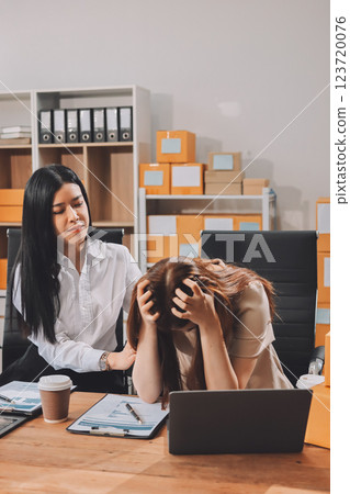 Startup SME small business entrepreneur of freelance Asian woman using a laptop with box Cheerful success Asian woman her hand lifts up online marketing packaging box and delivery SME idea concept Startup SME small business entrepreneur of freelance Asian woman using a laptop with box Cheerful success Asian woman her hand lifts up online marketing packaging box and delivery SME idea concept 123720076