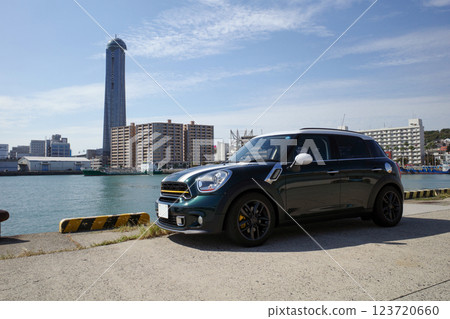 A photo of a car with the Straits Dream Tower in the background 123720660