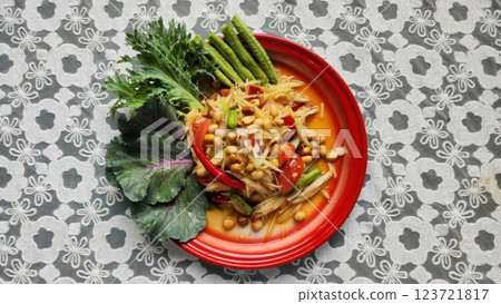 Colorful Fresh Vegetable Salad with Nuts and Spicy Dressing. Papaya salad. Thai Food Colorful Fresh Vegetable Salad with Nuts and Spicy Dressing. Papaya salad. Thai Food 123721817