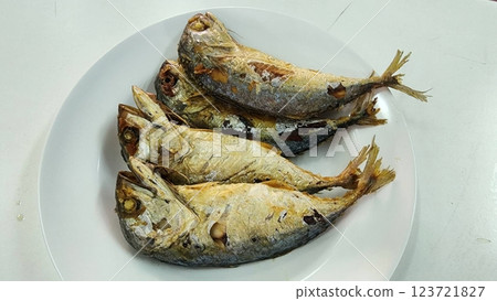 Fried Mackerel Fish. Freshly Cooked Fish on a White Plate Displayed for Presentation 123721827