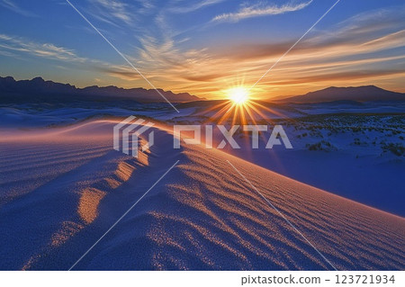 Sunrise over golden sand dunes in the desert creates a breathtaking view of nature's beauty at dawn Sunrise over golden sand dunes in the desert creates a breathtaking view of nature's beauty at dawn 123721934