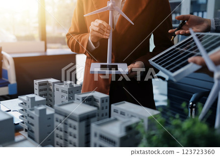 Discussion among businesspeople on the latest developments in solar cell panel technology and Solar Energy Environment city Concept. Discussion among businesspeople on the latest developments in solar cell panel technology and Solar Energy Environment city Concept. 123723360
