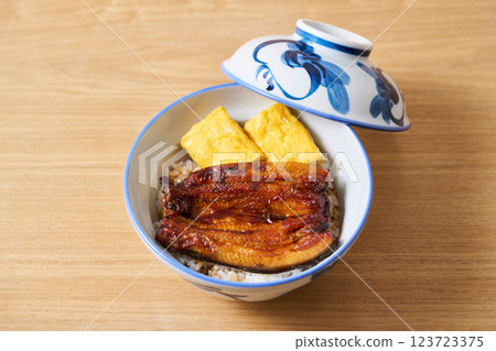 Eel rice bowl with fried egg Eel rice bowl with fried egg 123723375