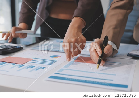 Accounting company provide finance and taxation planning for profitable cash flow, Auditor and accountant team working in office, analyze financial data and accounting record with calculator.Insight 123723389