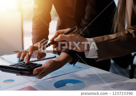 Accounting company provide finance and taxation planning for profitable cash flow, Auditor and accountant team working in office, analyze financial data and accounting record with calculator.Insight Accounting company provide finance and taxation planning for profitable cash flow, Auditor and accountant team working in office, analyze financial data and accounting record with calculator.Insight 123723390